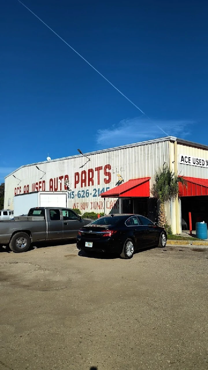 ACE Used Auto Parts store exterior with cars parked.