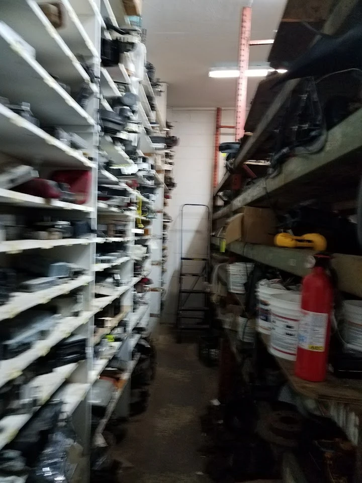 Aisle of truck parts in a storage facility.