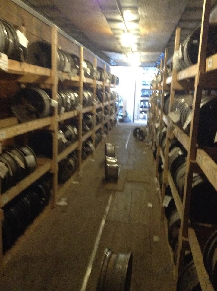 Aisle of wheels in auto parts storage area.