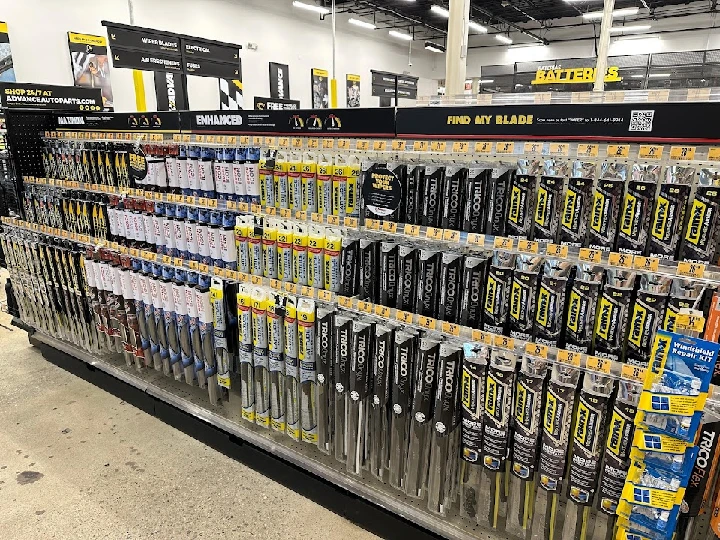 Auto parts display featuring wiper blades and tools.