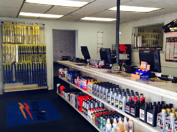 Auto parts store interior with shelves and counters.