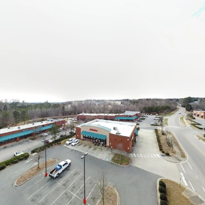 AutoZone store with parking lot and surrounding area.