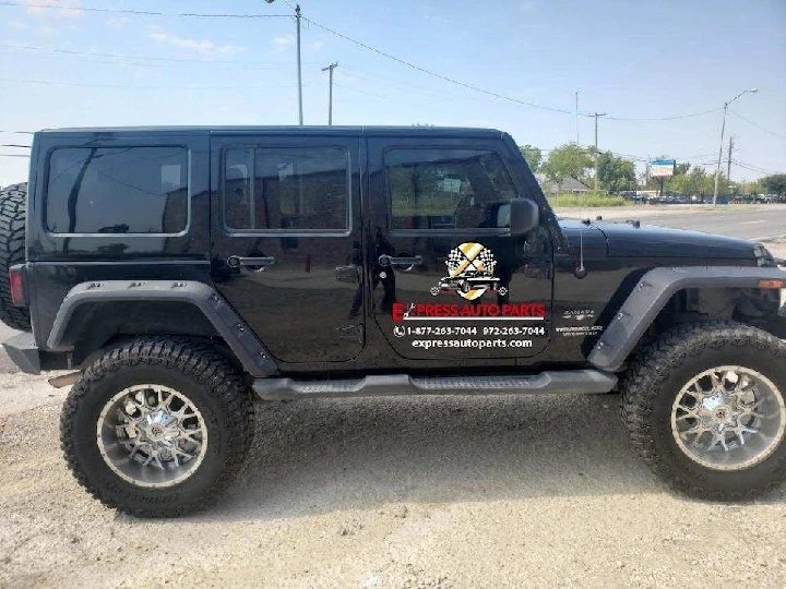 Black SUV parked outside an auto parts shop.