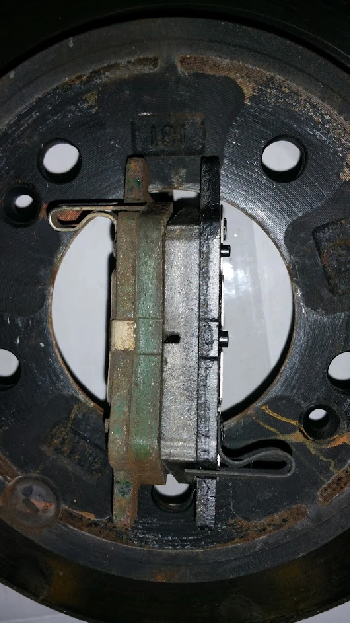 Brake pad and rotor assembly close-up view.