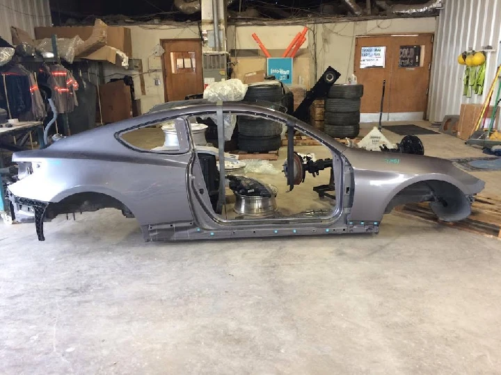 Car chassis in a workshop for auto parts.