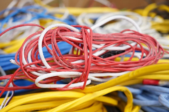 Coiled wires in various colors for recycling.