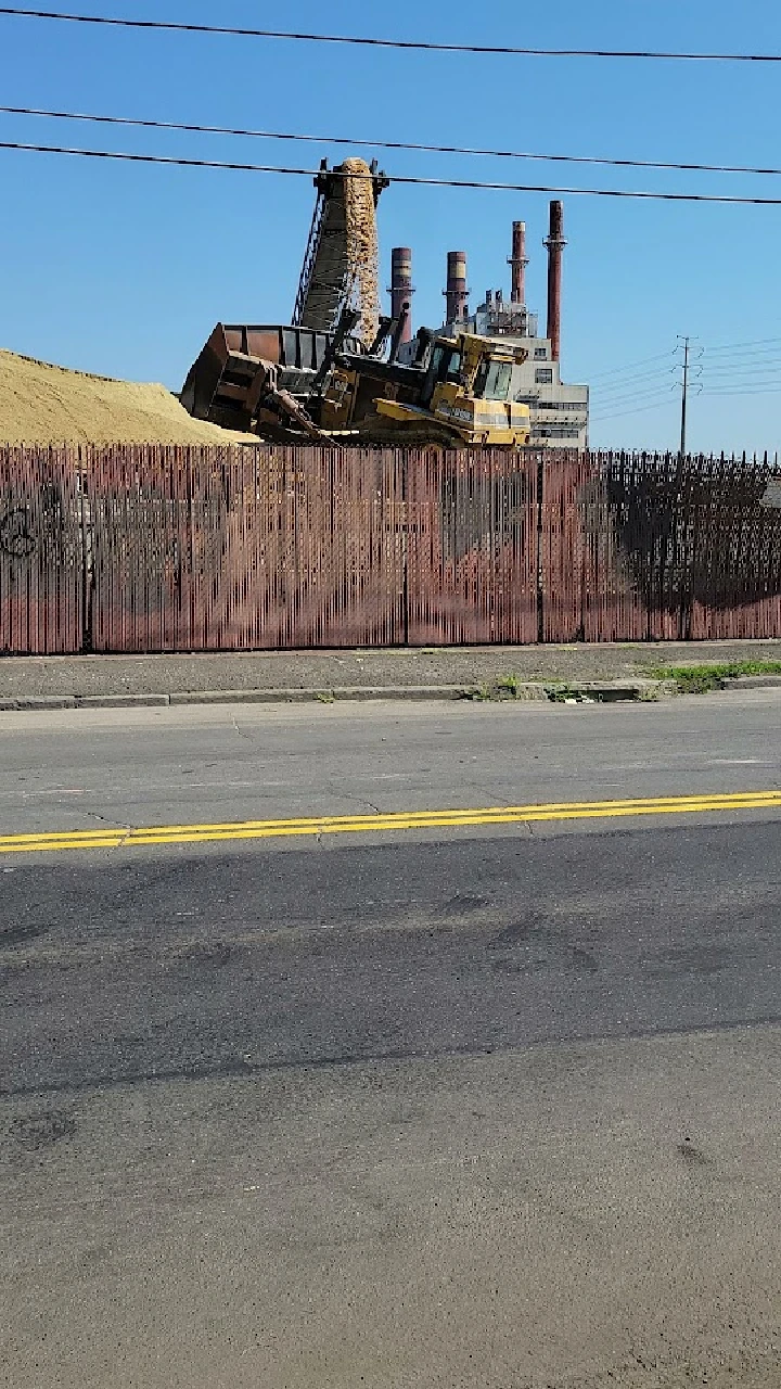 Construction equipment near a metal recycling facility.