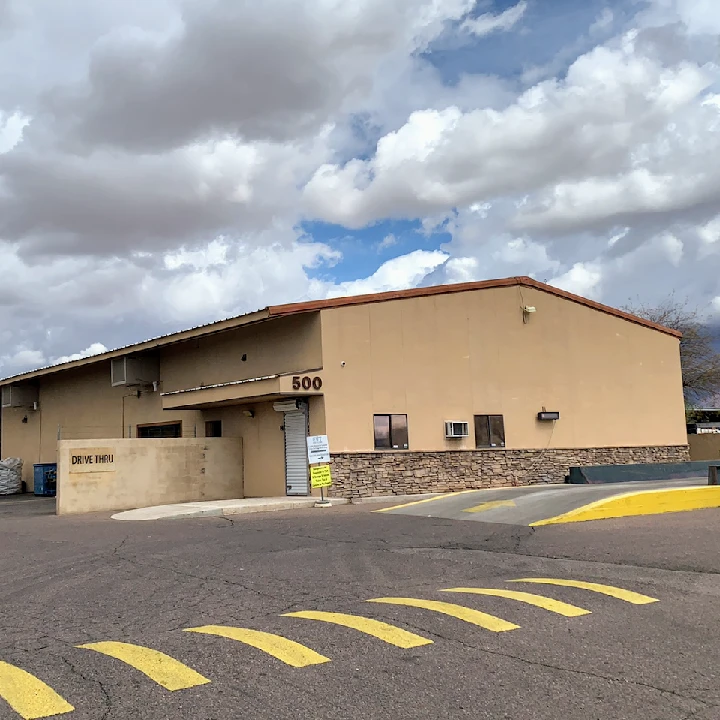 EVT Recycling facility exterior with cloudy sky.