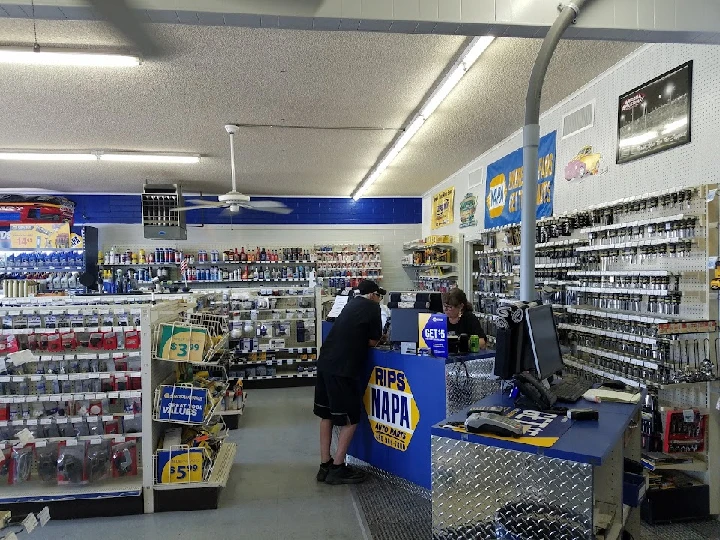 NAPA Auto Parts store interior with staff and supplies.