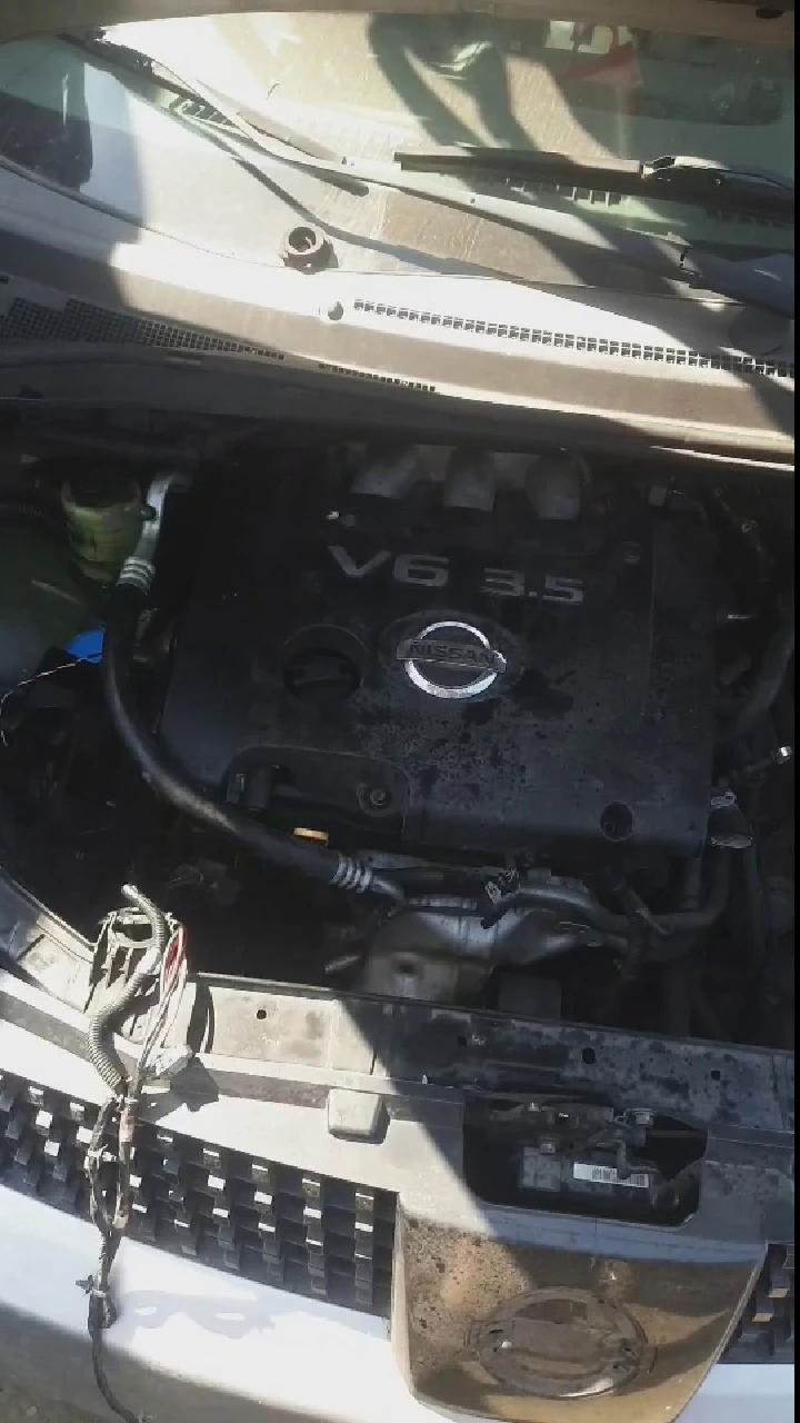 Nissan V6 3.5 engine in a vehicle engine bay.