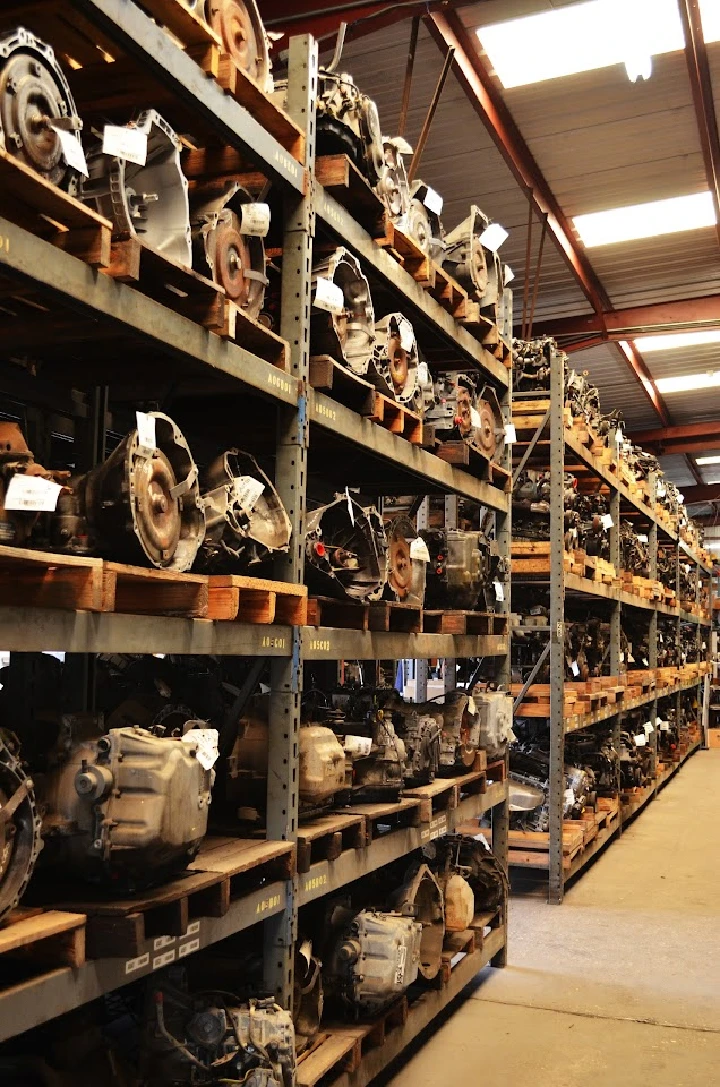 Rows of auto parts in a used parts warehouse.