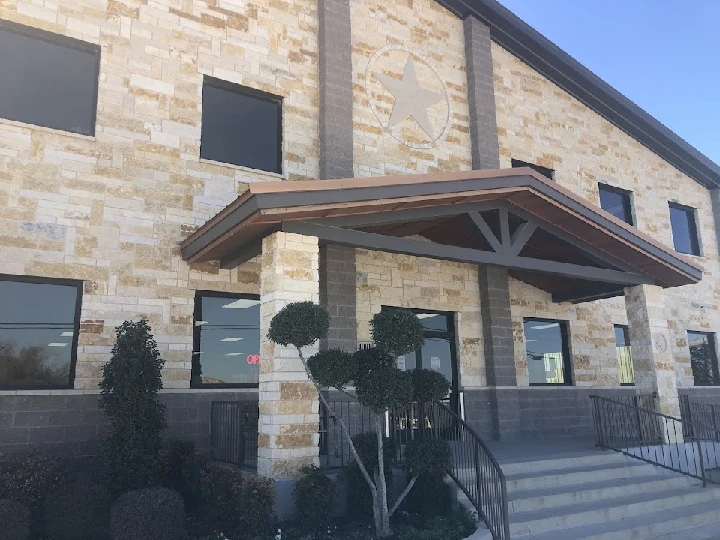 Texas Auto Recyclers building entrance with landscaping.