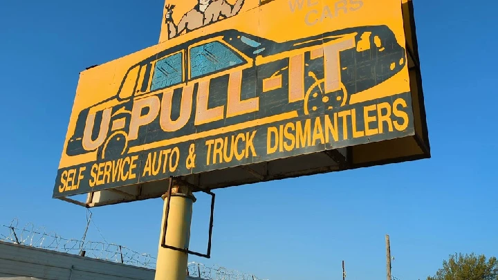 U Pull It sign for auto and truck dismantling services.