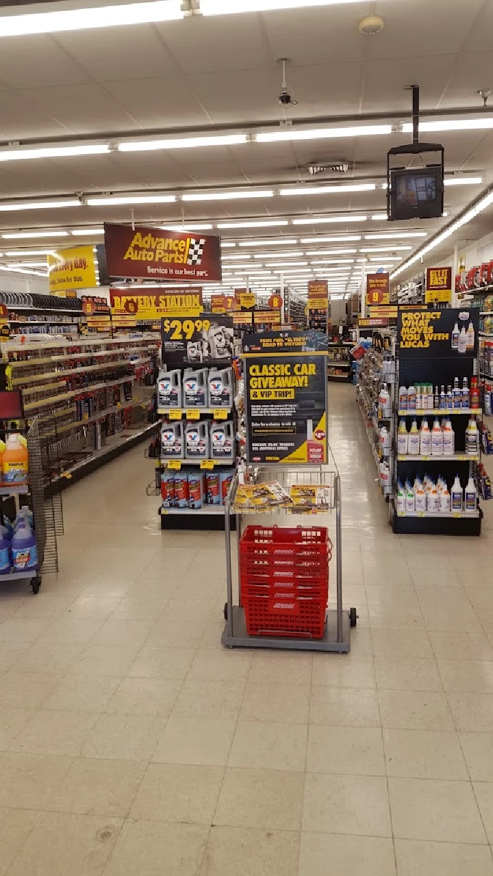 Advance Auto Parts store aisle with products on display.