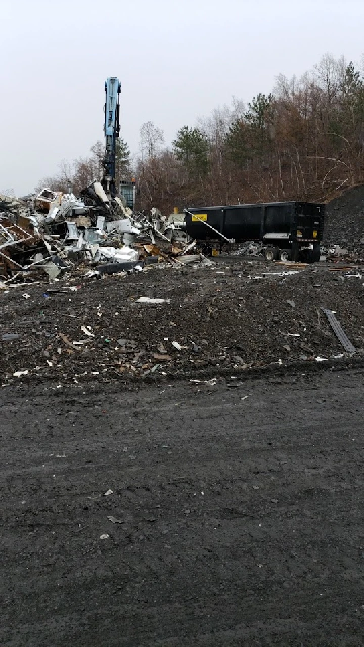 Construction site with debris and a dumpster.