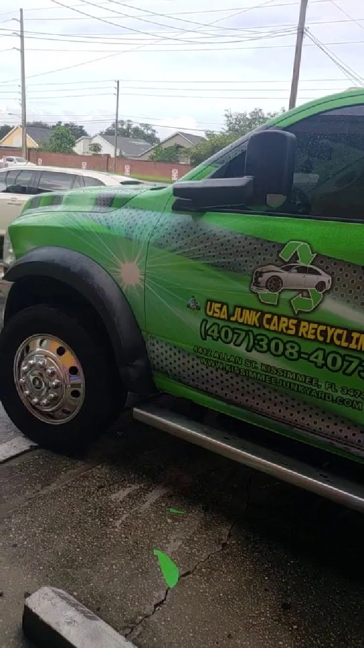 Green truck for USA Junk Cars Recycling Inc.