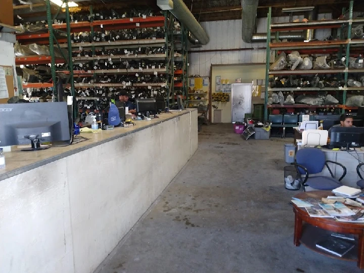 Office area of American Dismantling with shelving.