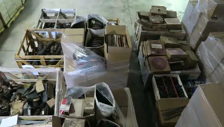 Overflowing boxes of auto parts and components.