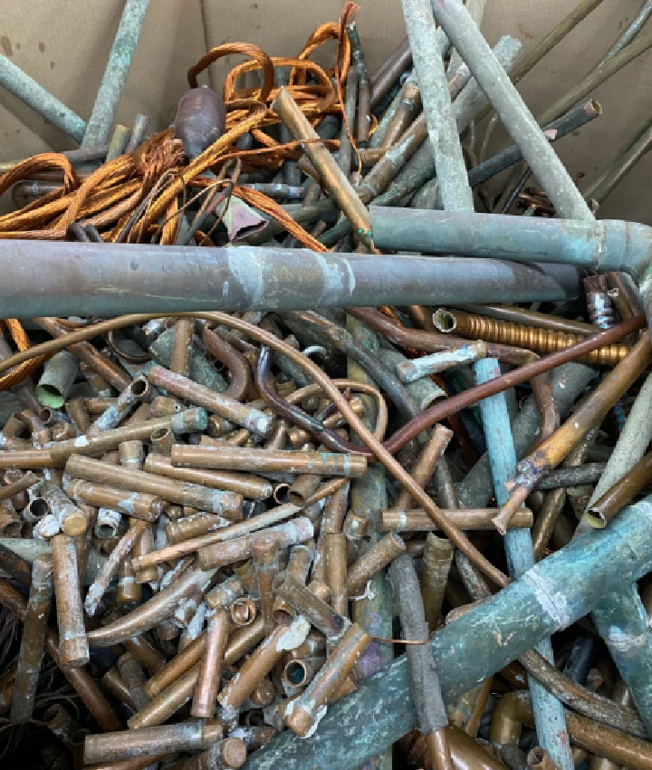 Pile of assorted metal pipes and scrap materials.