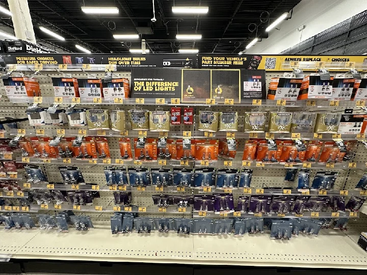 Shelf of various headlight and LED bulbs.