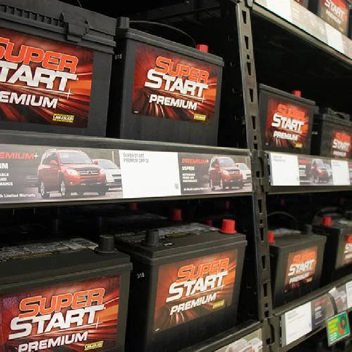 Shelves of Super Start Premium car batteries.