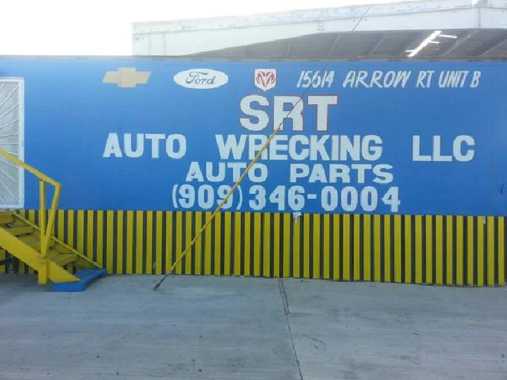 SRT Auto Wrecking LLC sign and contact information.