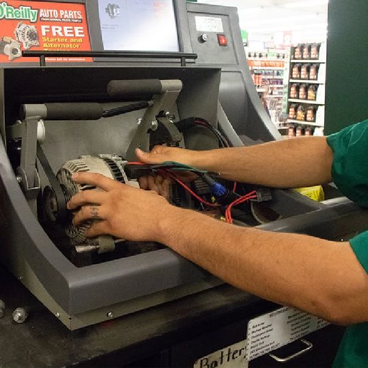 Technician testing an alternator at O'Reilly Auto Parts.