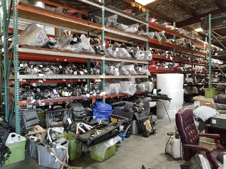 Warehouse filled with dismantled auto parts.