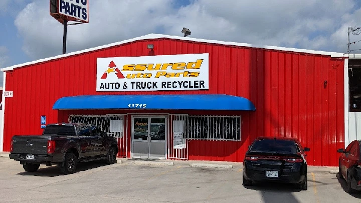 Assured Auto Parts building with blue awning.