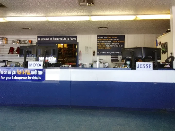 Assured Auto Parts reception area with signage.