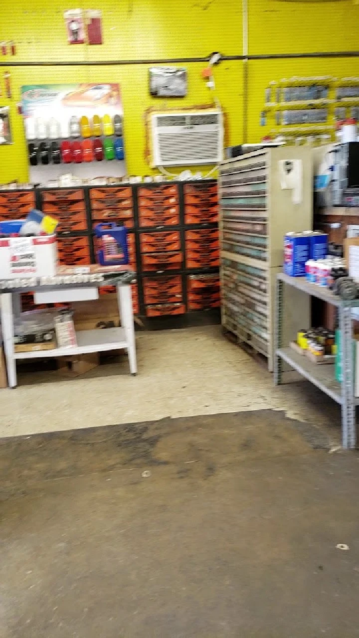 Auto parts and paint supplies store interior view.