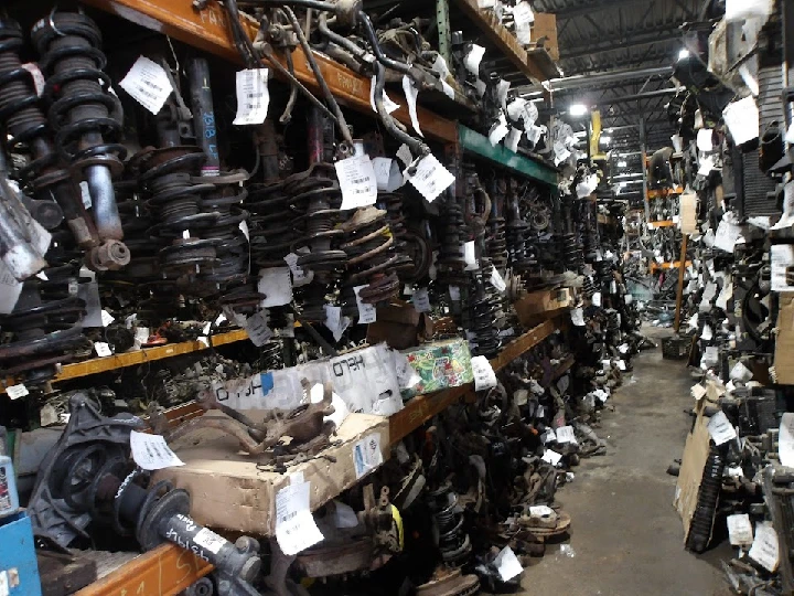 Auto parts and salvage inside a warehouse aisle.