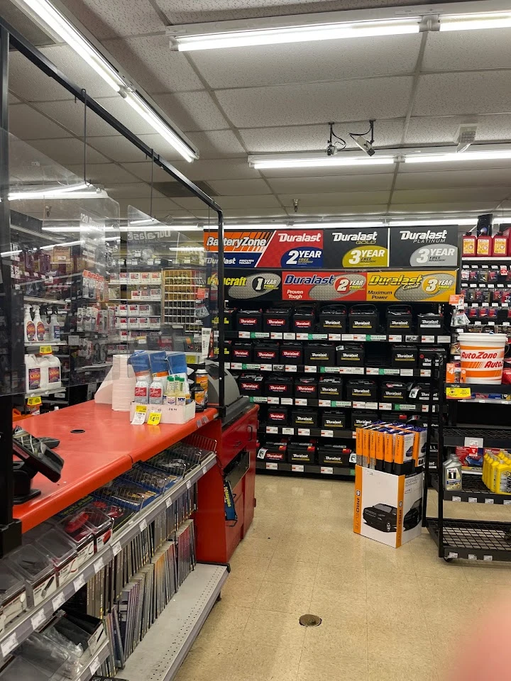 Auto parts store with batteries and supplies displayed.