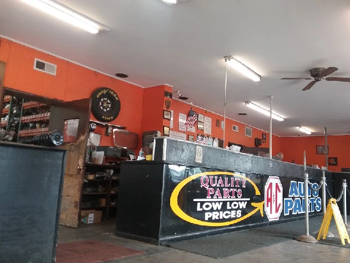 Auto parts store interior with bright orange walls.