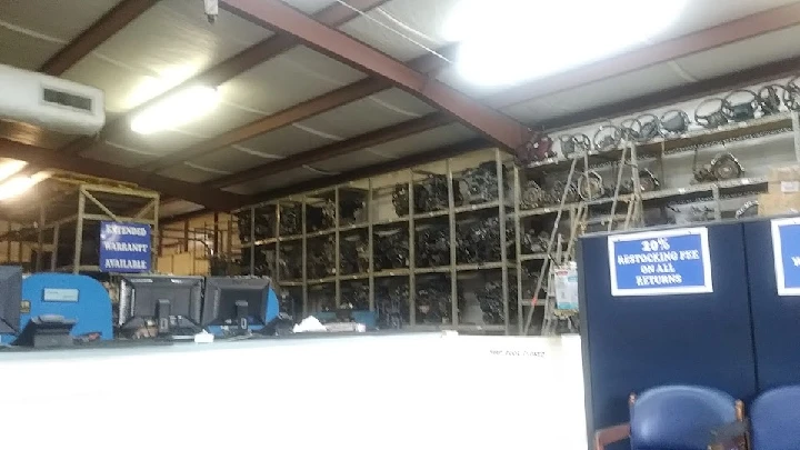 Auto parts store interior with shelves and desk.