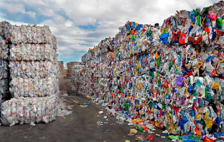 Baled plastic waste at a recycling facility.