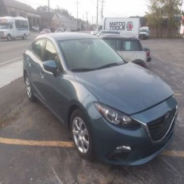 Blue sedan parked at Denison Auto Parts.