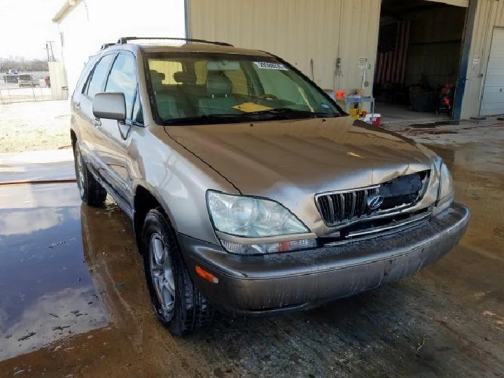 Damaged SUV in a salvage yard for cash offer.