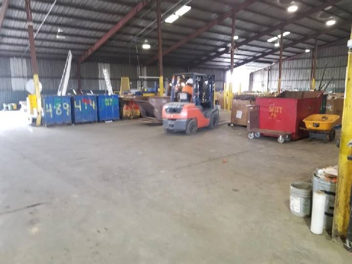 Forklift operating in a recycling facility.