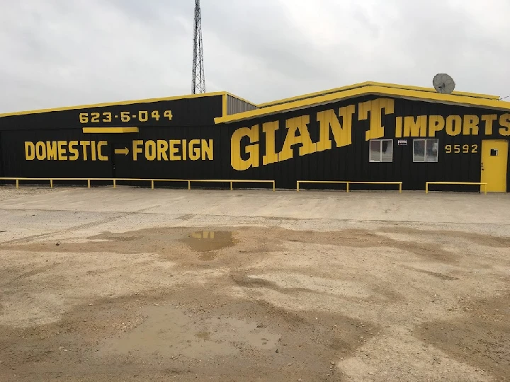 Giant Imports Junkyard building exterior with sign.