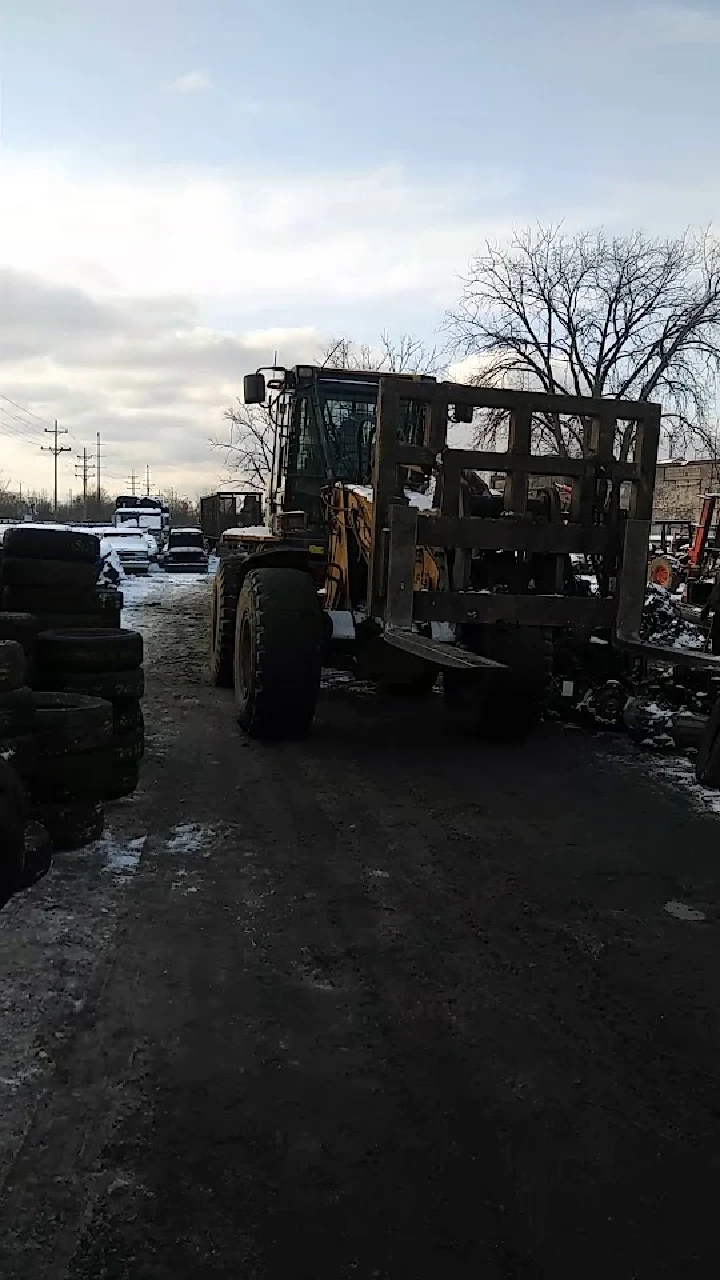 Heavy machinery on a gravel surface at a yard.