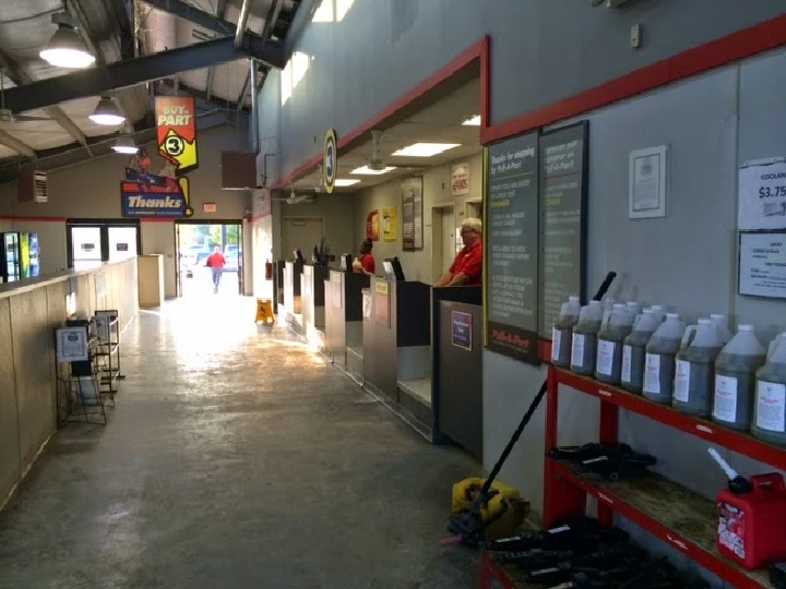 Inside Pull-A-Part with service counters and signage.