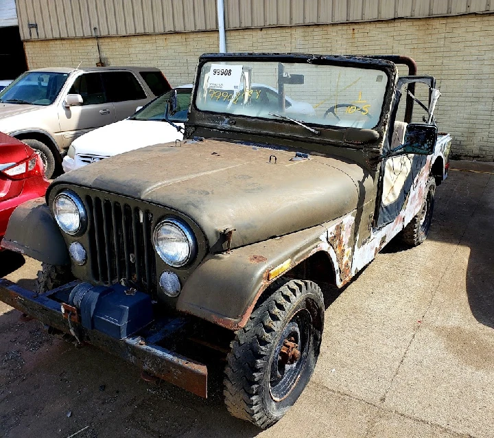 Old, rugged jeep for sale at Wrench' N Go.