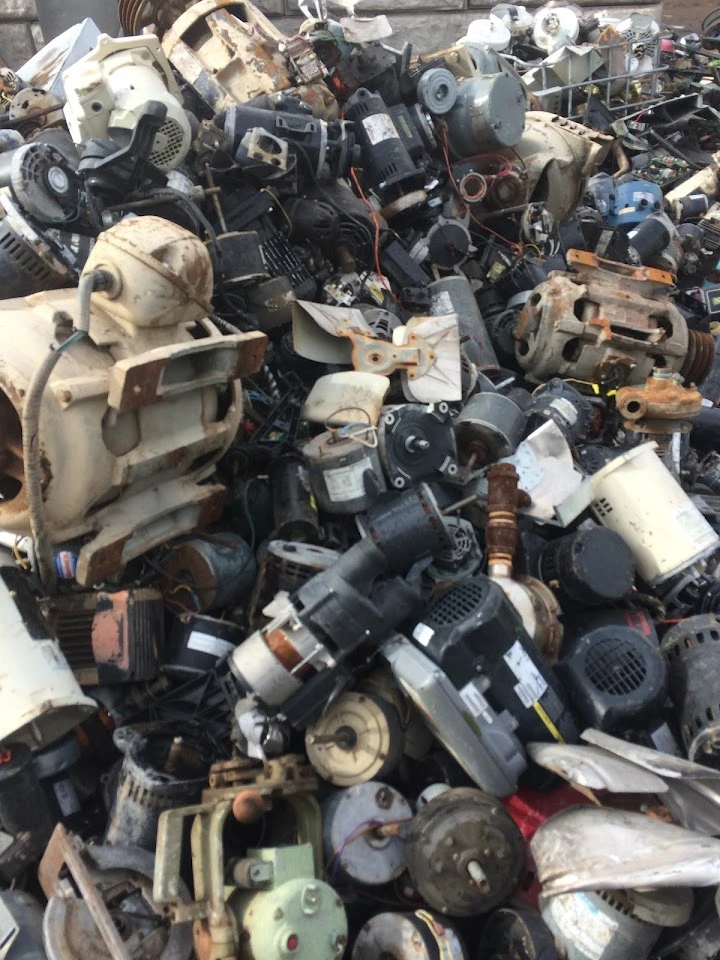 Piled scrap metal and discarded electrical motors.