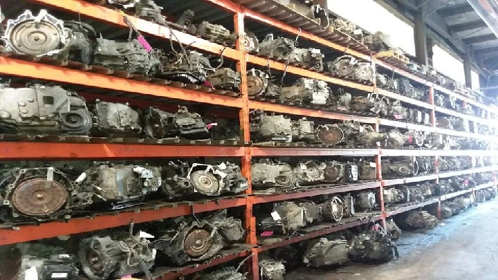 Shelves stacked with auto parts and engines.