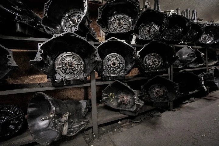 Shelves stacked with automotive transmission units.