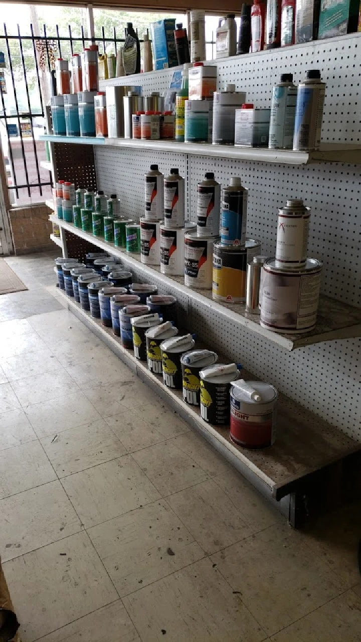 Shelves stocked with various paint supplies.