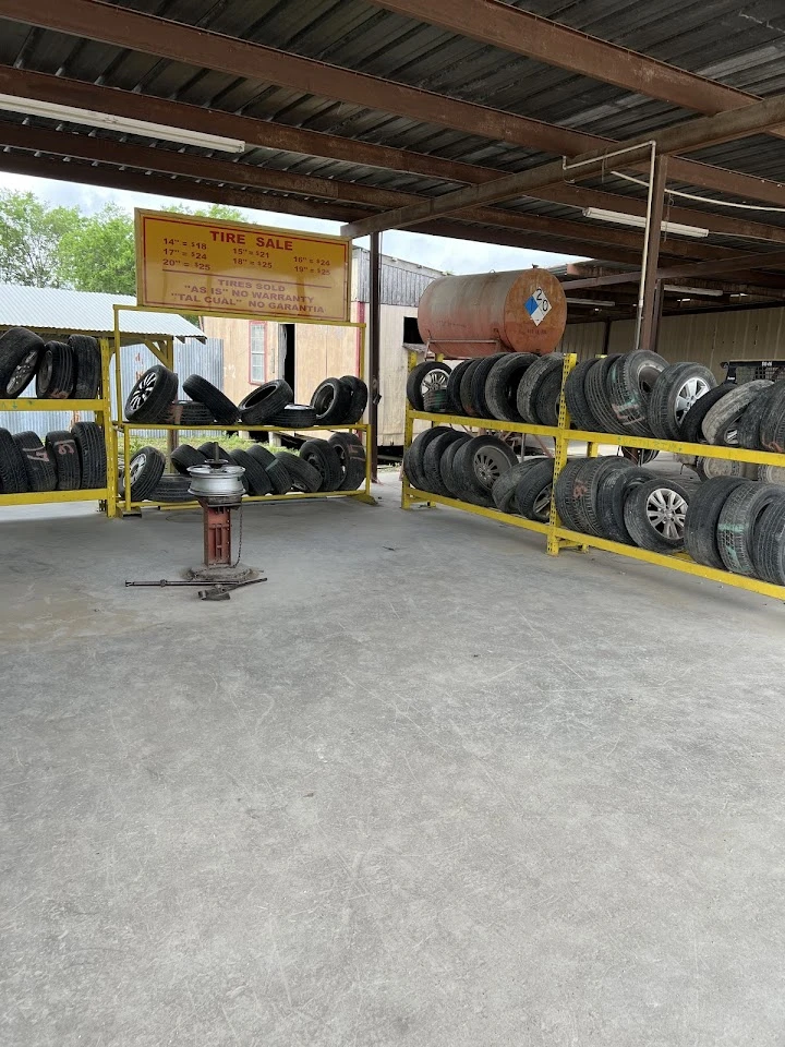 Tire sale area with various used tires displayed.