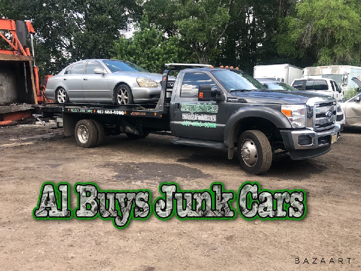 Tow truck carrying a junk car for Al Buys Junk Cars.