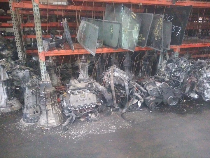 Used auto parts and engines in a junkyard.